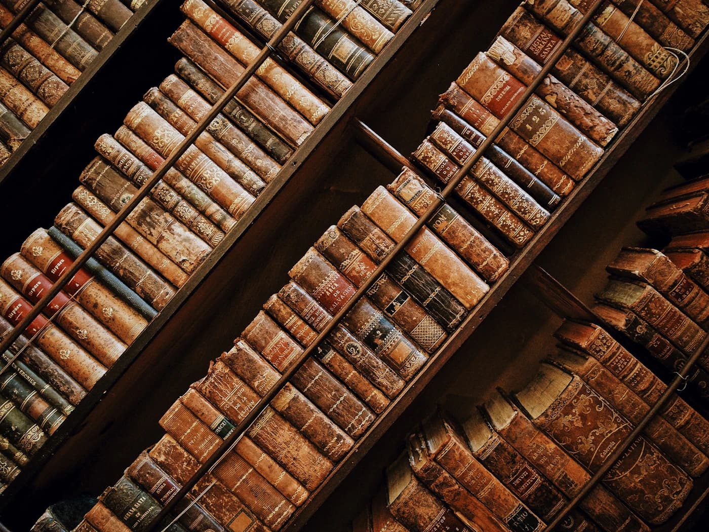 Old leather-bound books on a quiet desk
